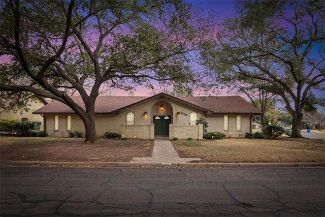 view of front of house featuring brick siding