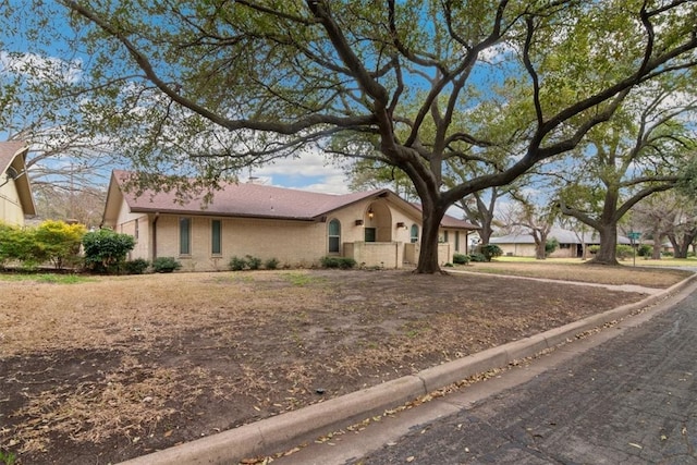 ranch-style home with brick siding