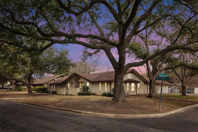 mid-century modern home featuring driveway and an attached garage