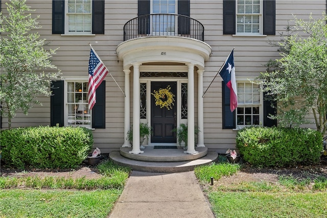 property entrance with a balcony