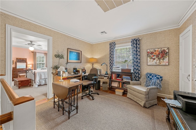 home office with carpet flooring, crown molding, ceiling fan, and a healthy amount of sunlight