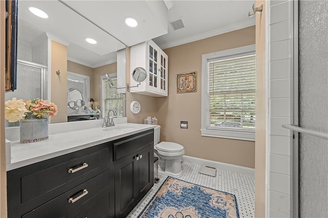 bathroom featuring tile patterned flooring, toilet, a shower with door, vanity, and ornamental molding