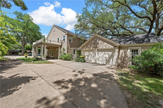 view of front facade featuring covered porch and a garage