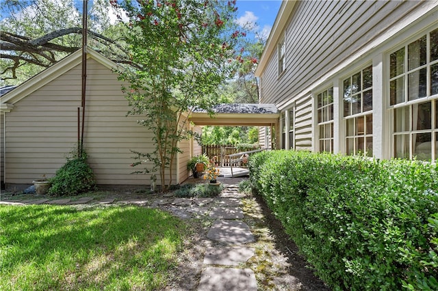 view of property exterior with a yard