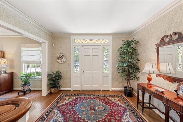 entryway featuring hardwood / wood-style floors and crown molding