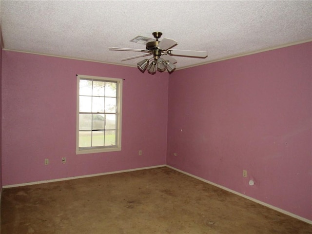 spare room with carpet, a textured ceiling, ceiling fan, and ornamental molding