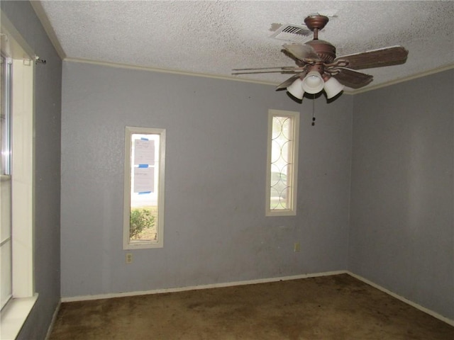 carpeted spare room featuring ceiling fan, a textured ceiling, and ornamental molding