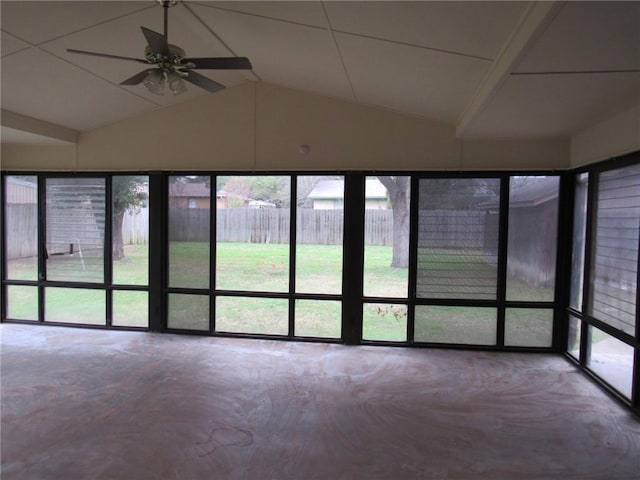 unfurnished sunroom featuring ceiling fan and vaulted ceiling