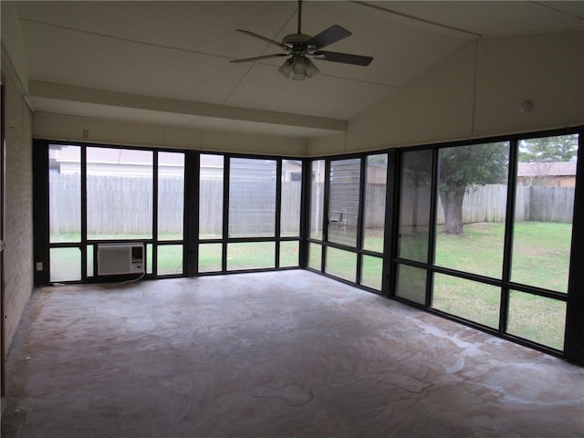 unfurnished sunroom with ceiling fan, a wall mounted AC, and vaulted ceiling