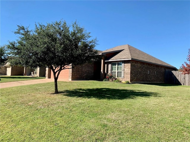 view of front of property with a garage and a front lawn