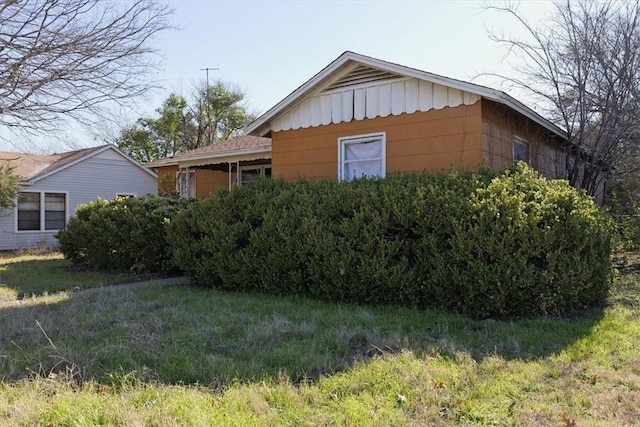 view of home's exterior with a lawn