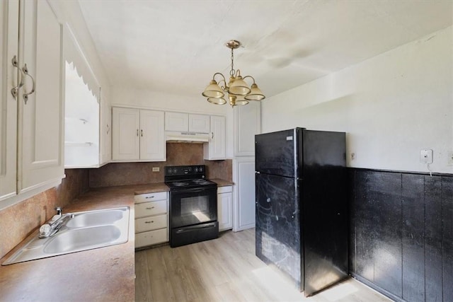 kitchen with sink, white cabinetry, backsplash, black appliances, and decorative light fixtures