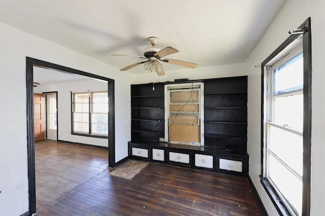 foyer with ceiling fan, a healthy amount of sunlight, and dark hardwood / wood-style floors