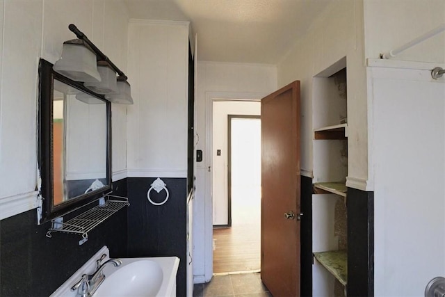 bathroom featuring tile patterned flooring and sink