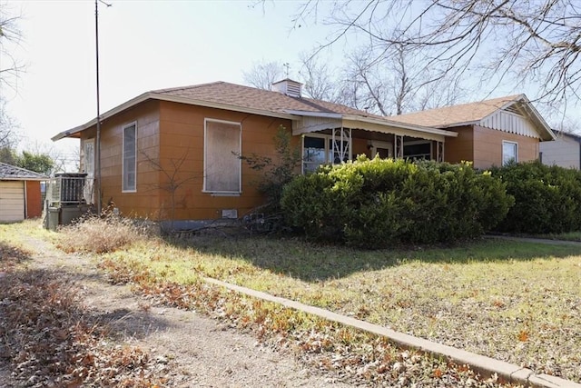 view of property exterior featuring a lawn