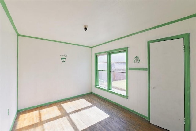 spare room with hardwood / wood-style flooring