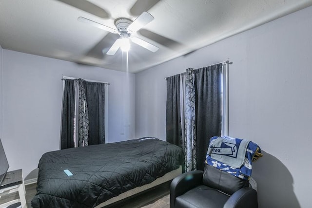 bedroom with hardwood / wood-style flooring and ceiling fan