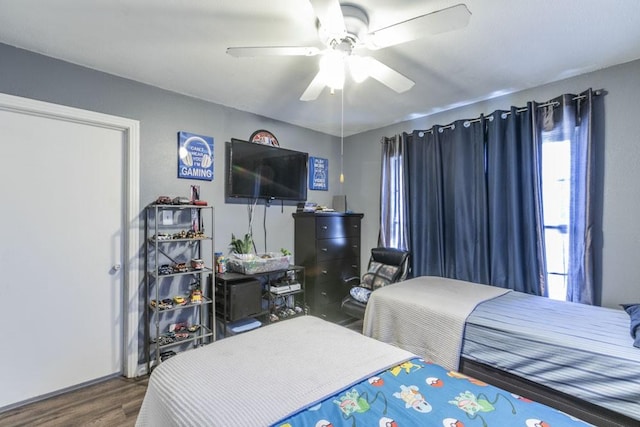 bedroom with hardwood / wood-style floors and ceiling fan