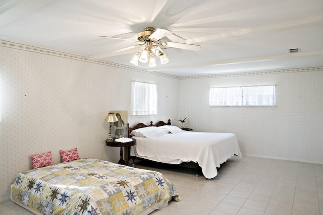 tiled bedroom with ceiling fan