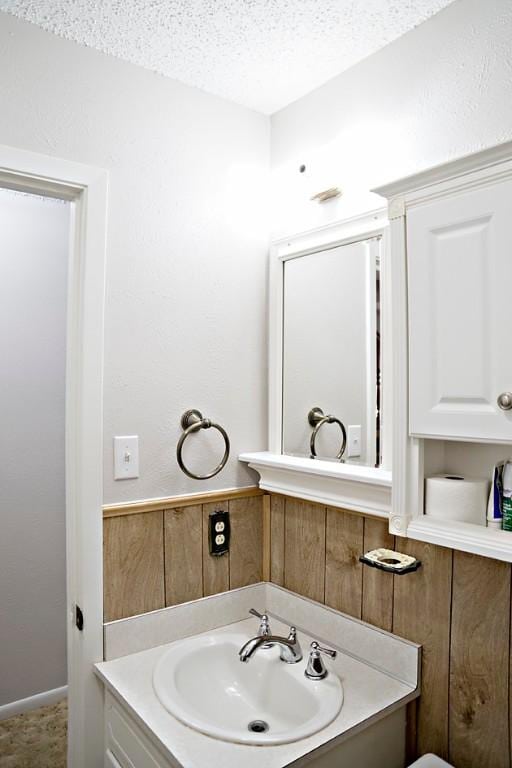 bathroom featuring vanity and a textured ceiling