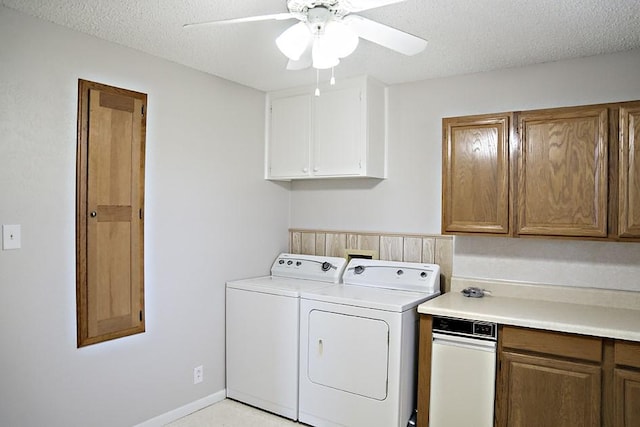 clothes washing area with ceiling fan, washing machine and dryer, and a textured ceiling