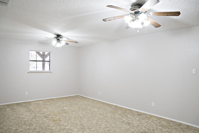 unfurnished room featuring carpet floors and a textured ceiling