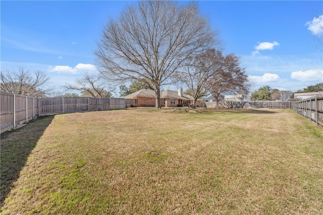 view of yard featuring a fenced backyard