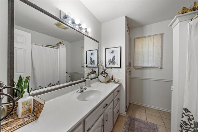 bathroom featuring visible vents, tile patterned flooring, and vanity