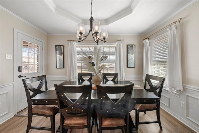 dining area featuring a chandelier, a healthy amount of sunlight, and light wood-style flooring