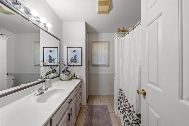 bathroom with vanity, tile patterned flooring, and visible vents