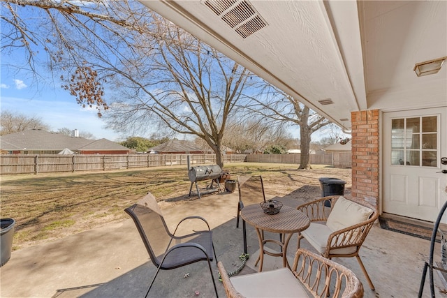 view of patio / terrace featuring a fenced backyard and visible vents