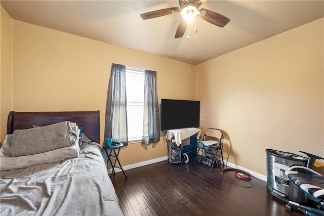 bedroom with dark wood-type flooring and ceiling fan