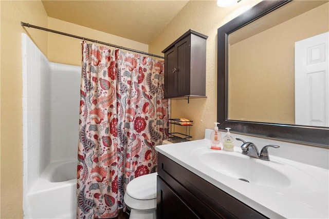 full bathroom with shower / tub combo, vanity, and toilet