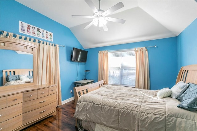 bedroom with ceiling fan, dark wood-type flooring, and vaulted ceiling