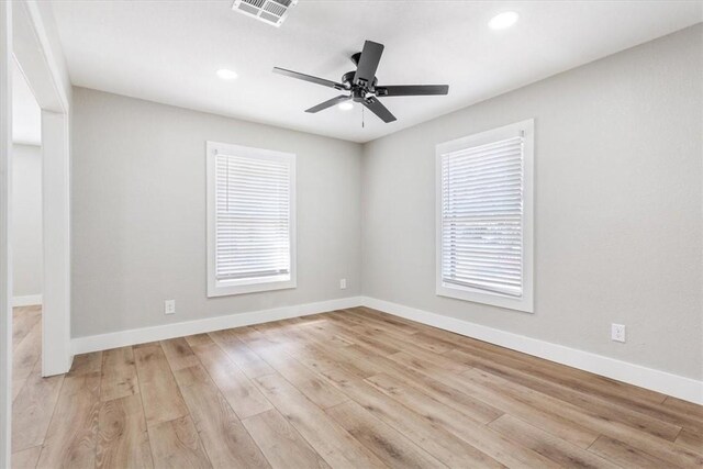 empty room with light hardwood / wood-style flooring and ceiling fan