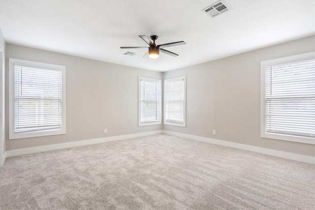 carpeted empty room with ceiling fan