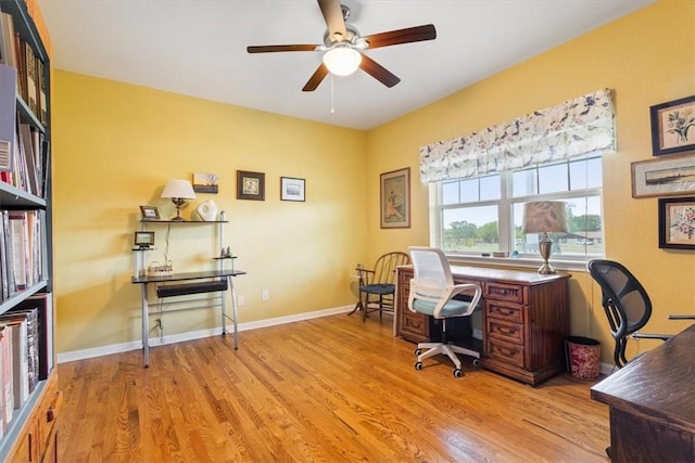 home office featuring ceiling fan and light hardwood / wood-style floors