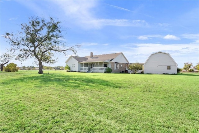 view of yard with covered porch