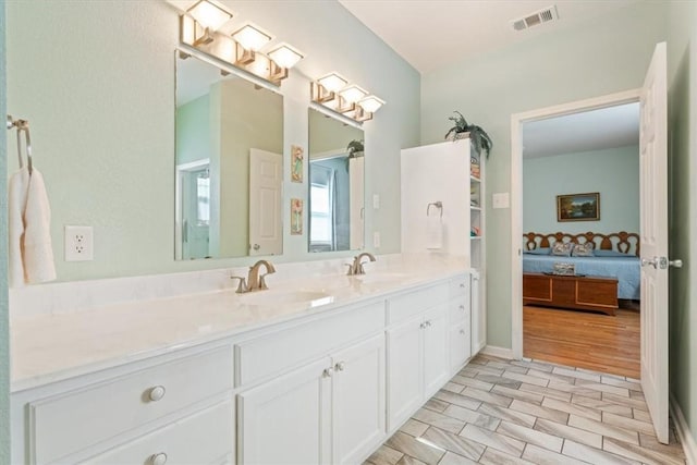 bathroom featuring hardwood / wood-style flooring and vanity