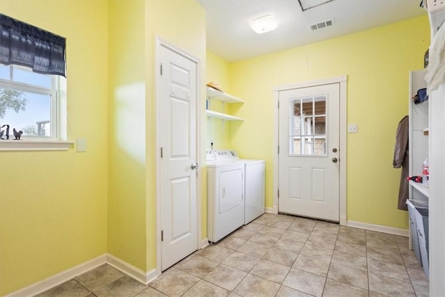 washroom featuring light tile patterned flooring and separate washer and dryer