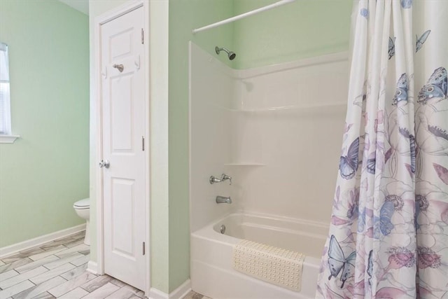 bathroom with shower / bath combination with curtain, wood-type flooring, and toilet