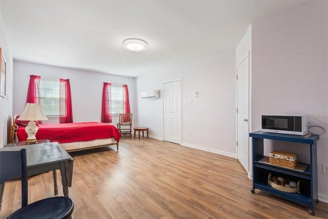 bedroom with wood-type flooring