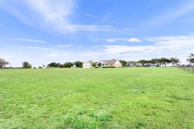 view of yard with a rural view