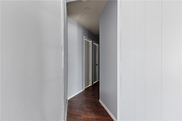 corridor featuring dark hardwood / wood-style floors