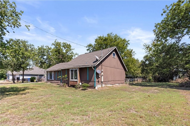 view of home's exterior featuring a yard