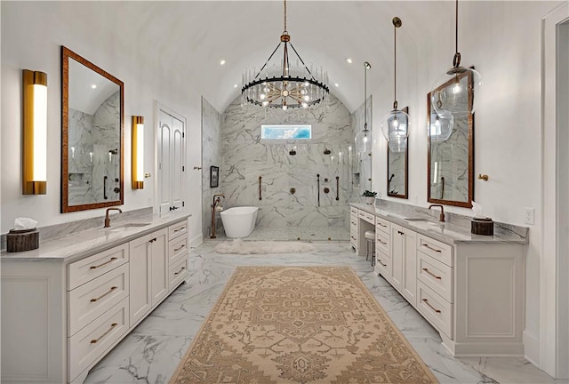 bathroom with lofted ceiling, vanity, a chandelier, and separate shower and tub