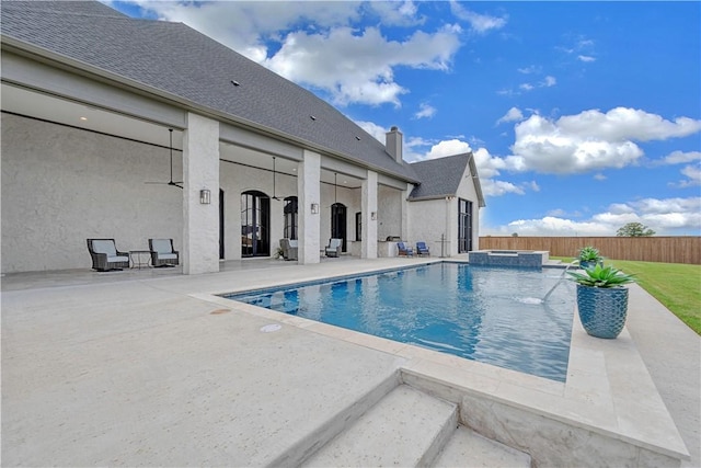 view of swimming pool with an in ground hot tub and a patio area