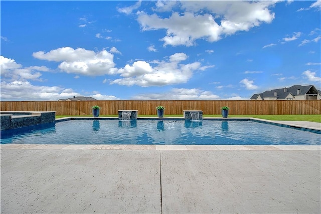 view of pool with pool water feature, an in ground hot tub, and a patio area