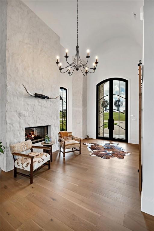 entryway featuring plenty of natural light, hardwood / wood-style floors, and a fireplace