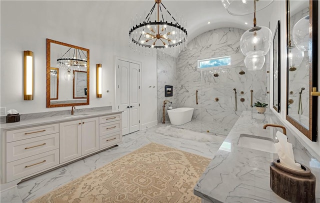 bathroom with lofted ceiling, vanity, shower with separate bathtub, and a notable chandelier